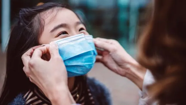 A child with a facemask
